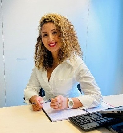 Nora Bafrouri at her office desk